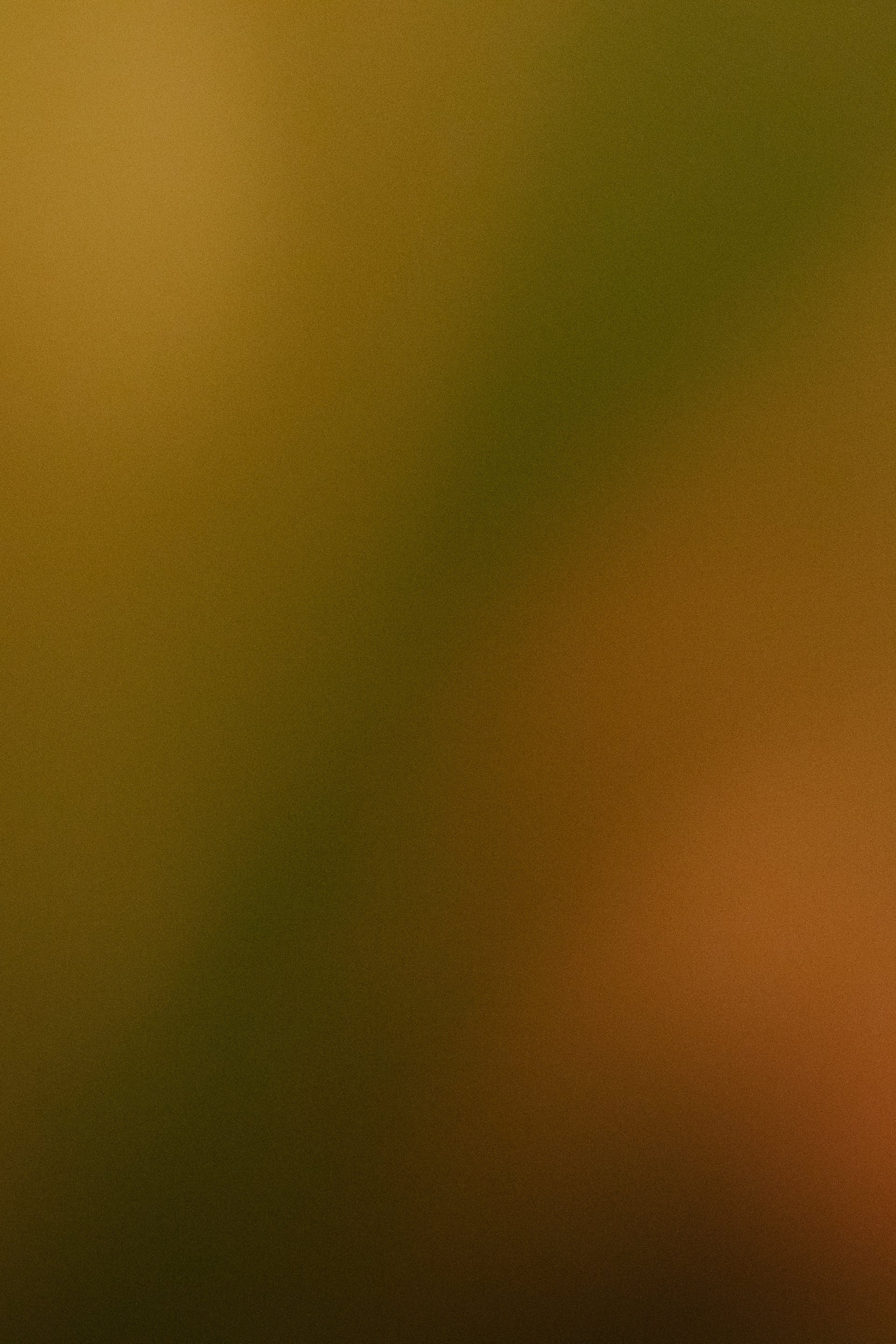 Blurred abstract background with brown and green tones